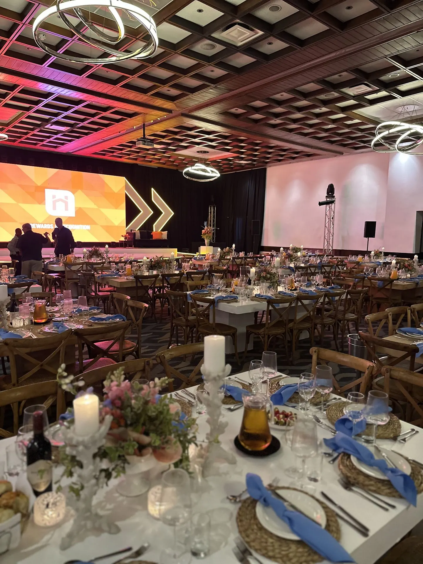 Year-end gala dinner in a warmly lit Durban ballroom