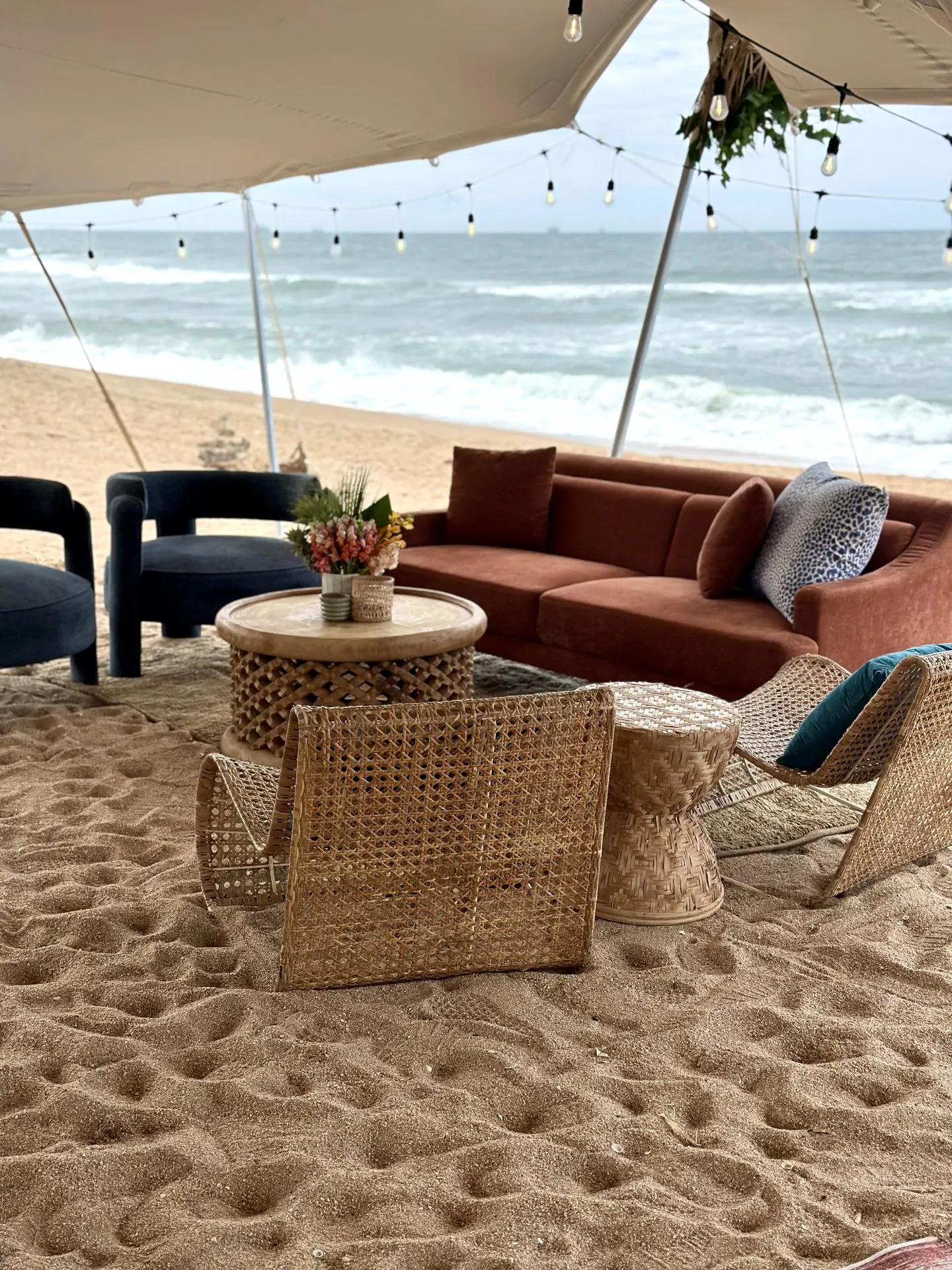 C&M Events — beachside lounge under a stretch tent