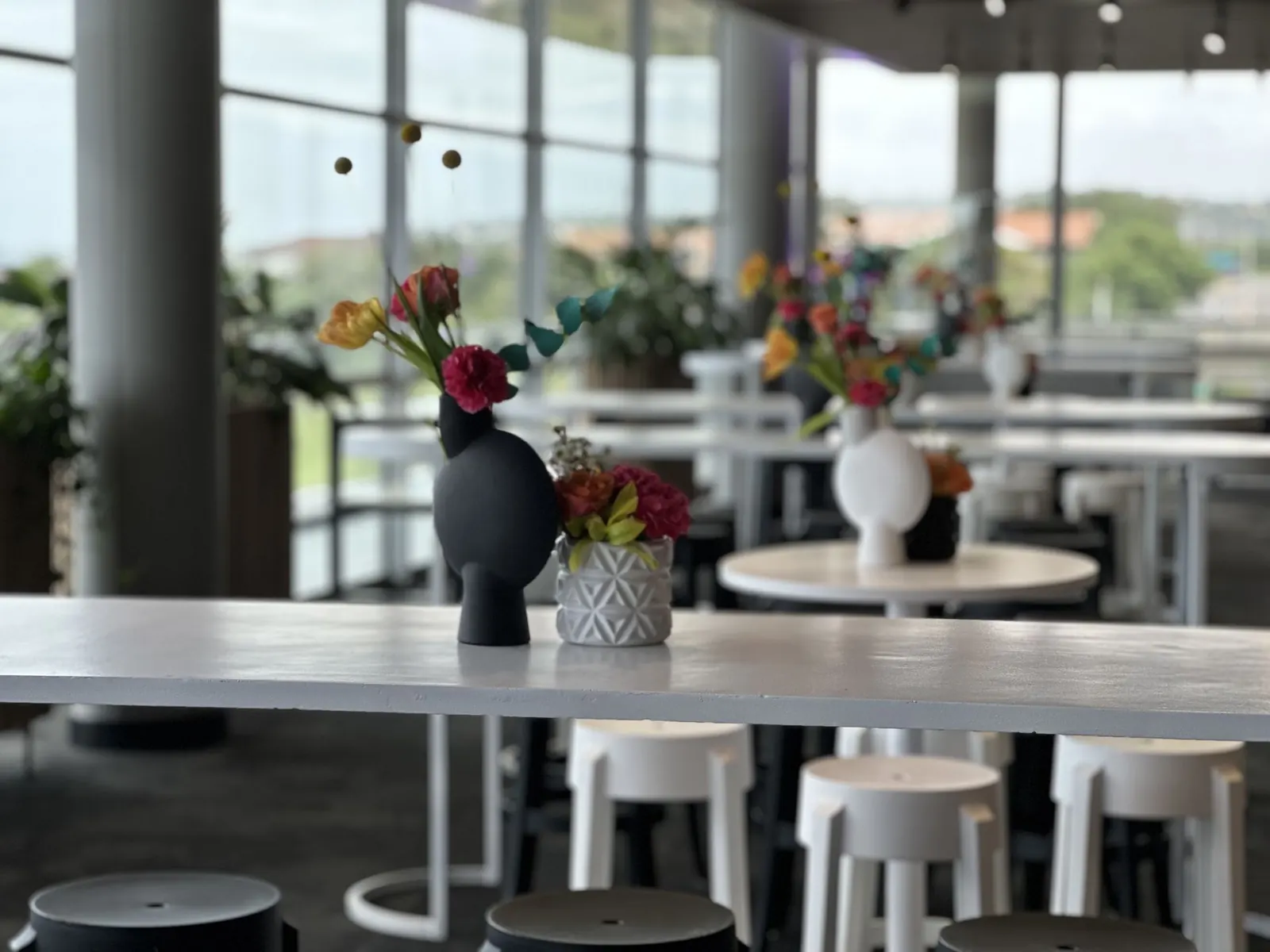 Colourful floral styling in a glass venue in Durban